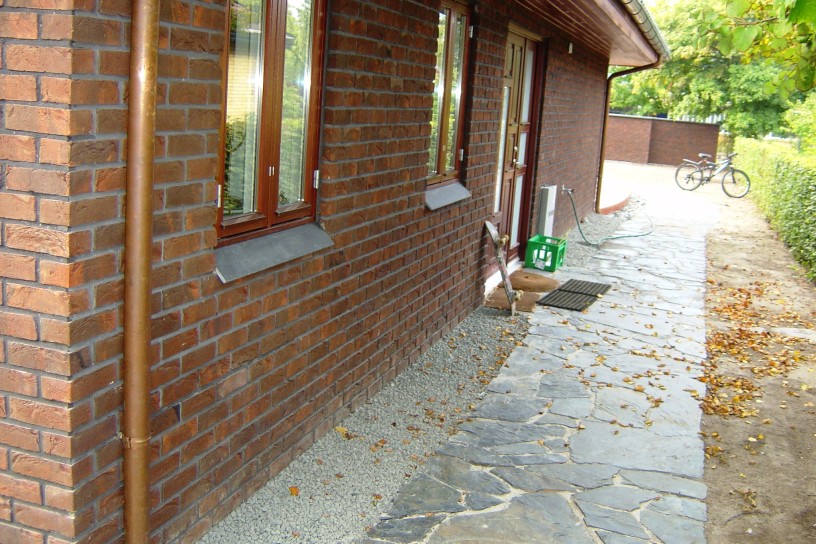 Replacement of roofing material, brick elevation, stone path